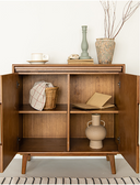 Born in Colour wooden sideboard with open doors displaying decorative items and storage space