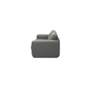 Side view of a grey Giormani sofa with cushioned armrest and backrest against black background