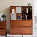 Born in Colour wooden cabinet with multiple compartments and shelves in a modern living space